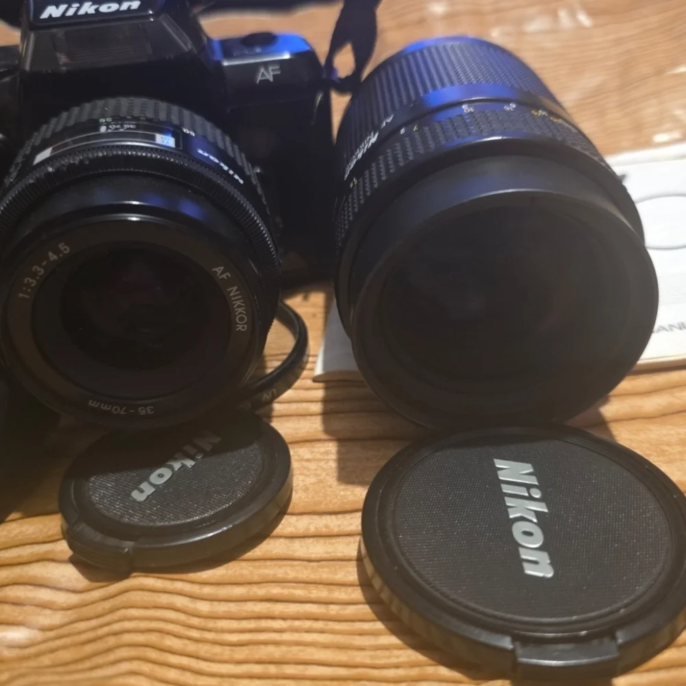 Nikon N4004 AF camera w/ 2 lenses, Flash, Film and Accessories